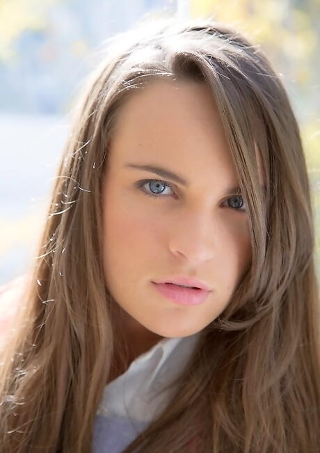 Slim american youthful Teal Conrad in skirt showing big knockers and hot ass outside